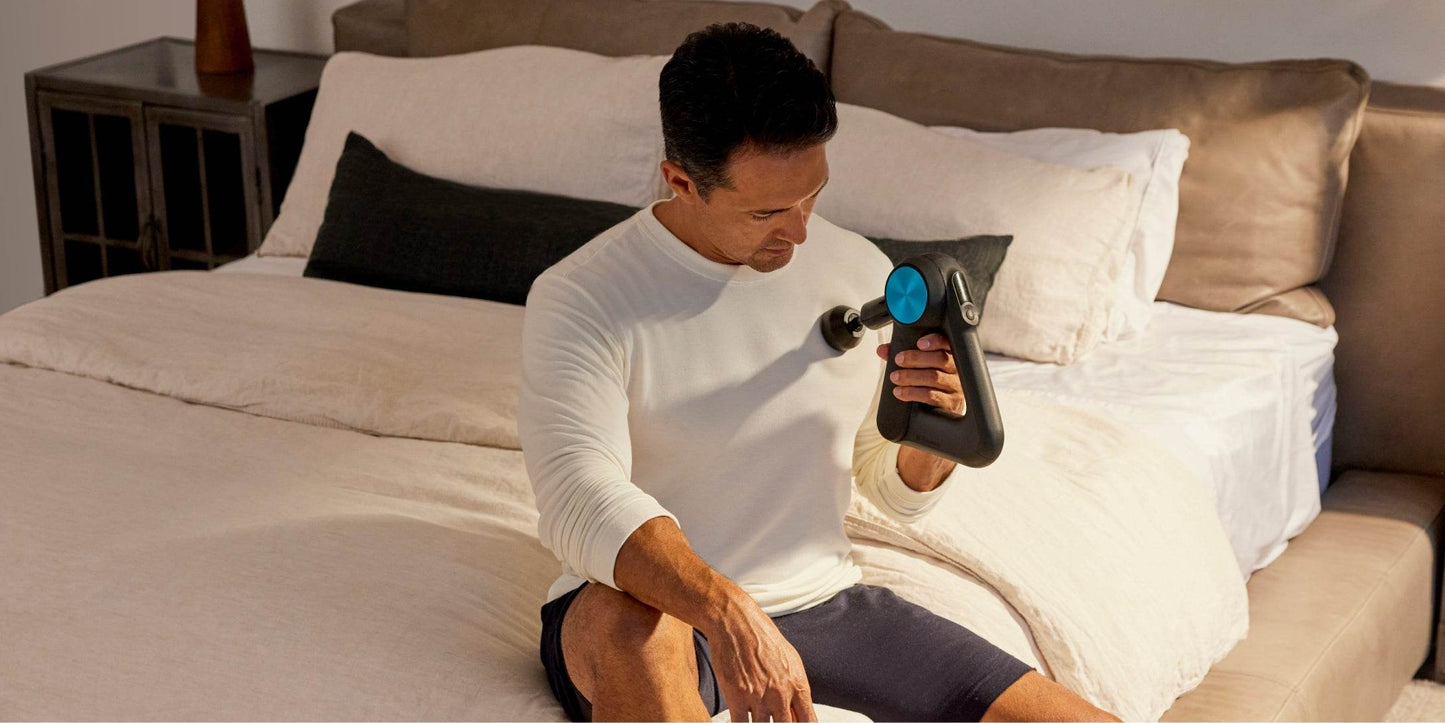 Massage guns like Theragun Can Help Improve Sleep, Study Shows - man using massage gun